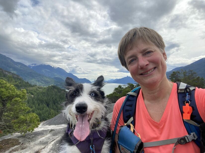 Maren Bruun with her dog Ivy on a hike.
