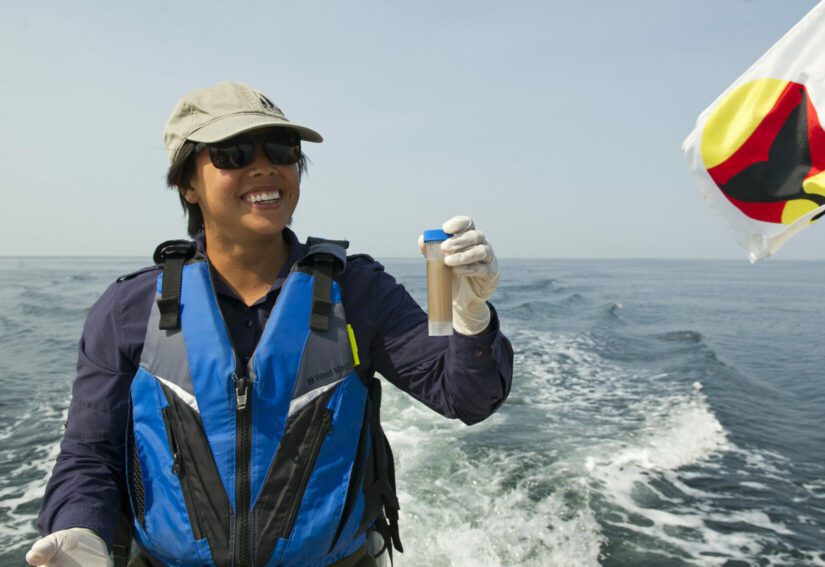 Collette Yee holding orca poop