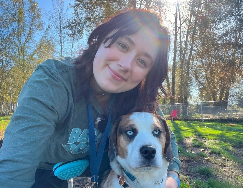 AnimalKind trainer Emily Westfall of Epsilon Dog Training with her dog at a park