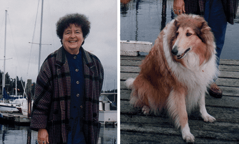 A photo of Joan Hafeez, a lovely lady with curly short hair and a warm smile, stands in front of a harbour. With her is her dog Maggie, a large fluffy rough collie with her tongue happily poking out.
