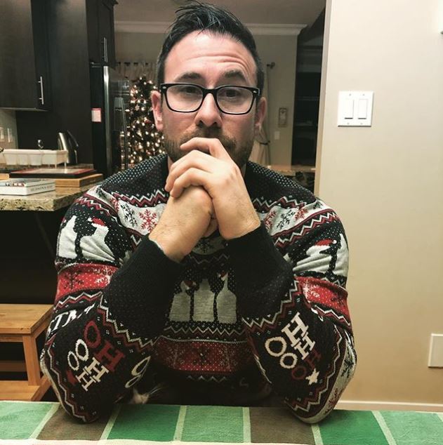 Howard the tuxedo kitten is hiding during a game of cards