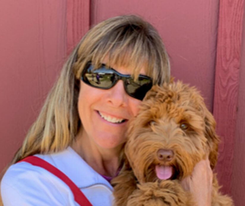 Animalkind accredited Country Canine Care's founder and trainer Lisadawn Shackleford with one of her dogs.