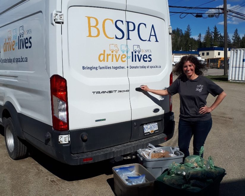 Victoria Olynik outside truck with pet food bank